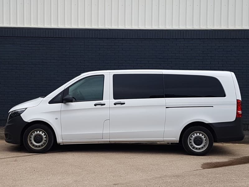 White Mercedes Vito minibus, side profile, used for airport transfers
